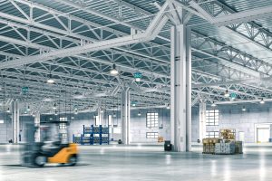 Wide-angle view of a spacious, well-lit warehouse with forklift in motion blur. 3d render