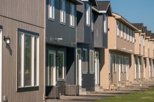 Exterior shot depicting a row of townhomes.